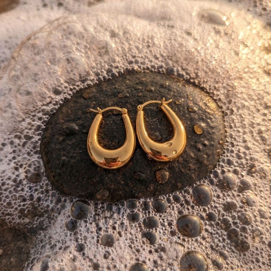 A pair of polished gold hoop anti tarnish earrings 