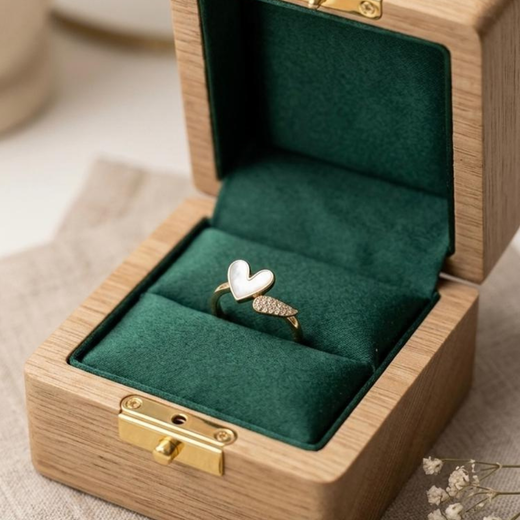 Gold ring with a heart design.