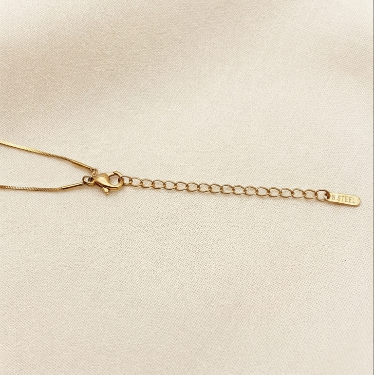 gold chain necklace with a lobster clasp and an adjustable extension chain
