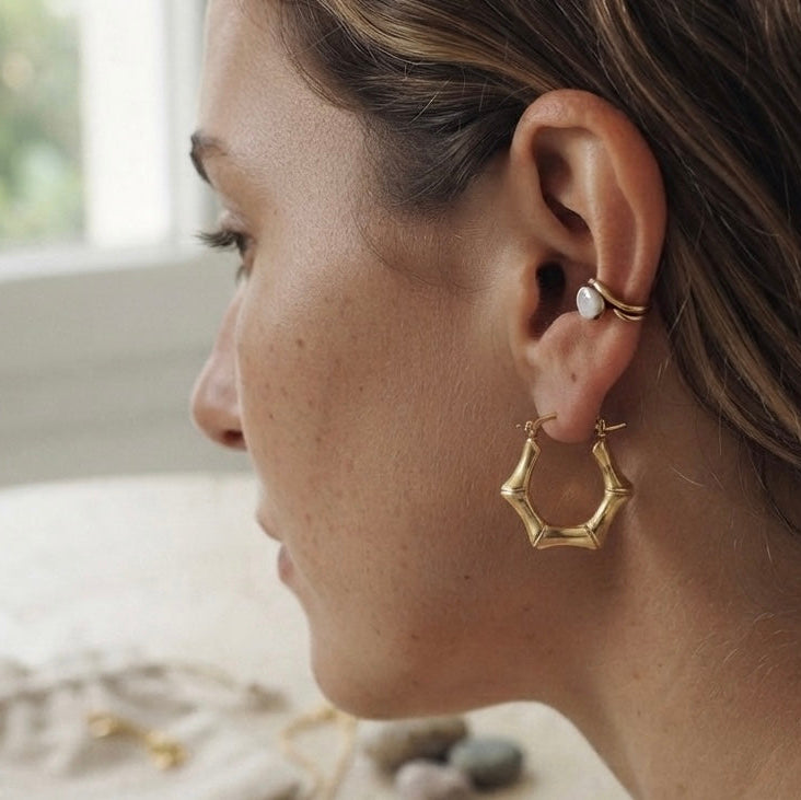 gold hoop earring with a textured, multi-pointed design