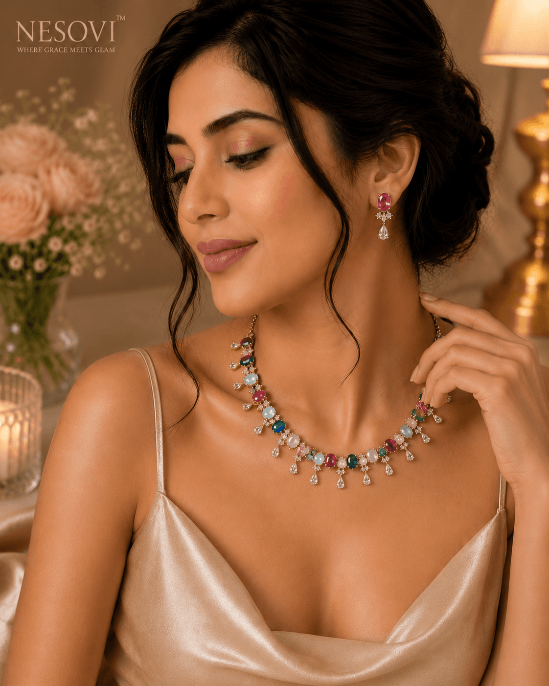 A woman wearing a colorful gemstone necklace and matching drop earrings by Nesovi